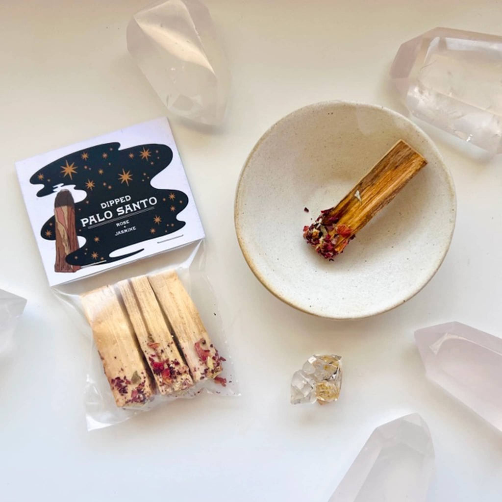 Ark Made Rose and Jasmine Dipped Palo Santo Sticks, pack of 3 in packaging with one in a bowl beside it, surrounded by crystals.