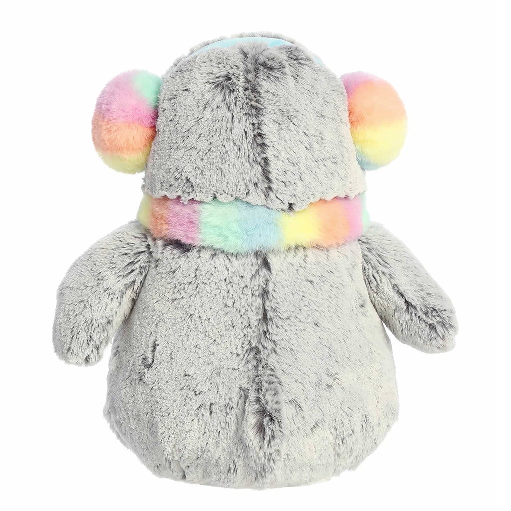 Plush penguin toy with a colorful scarf and earmuffs, back view, on a white background.