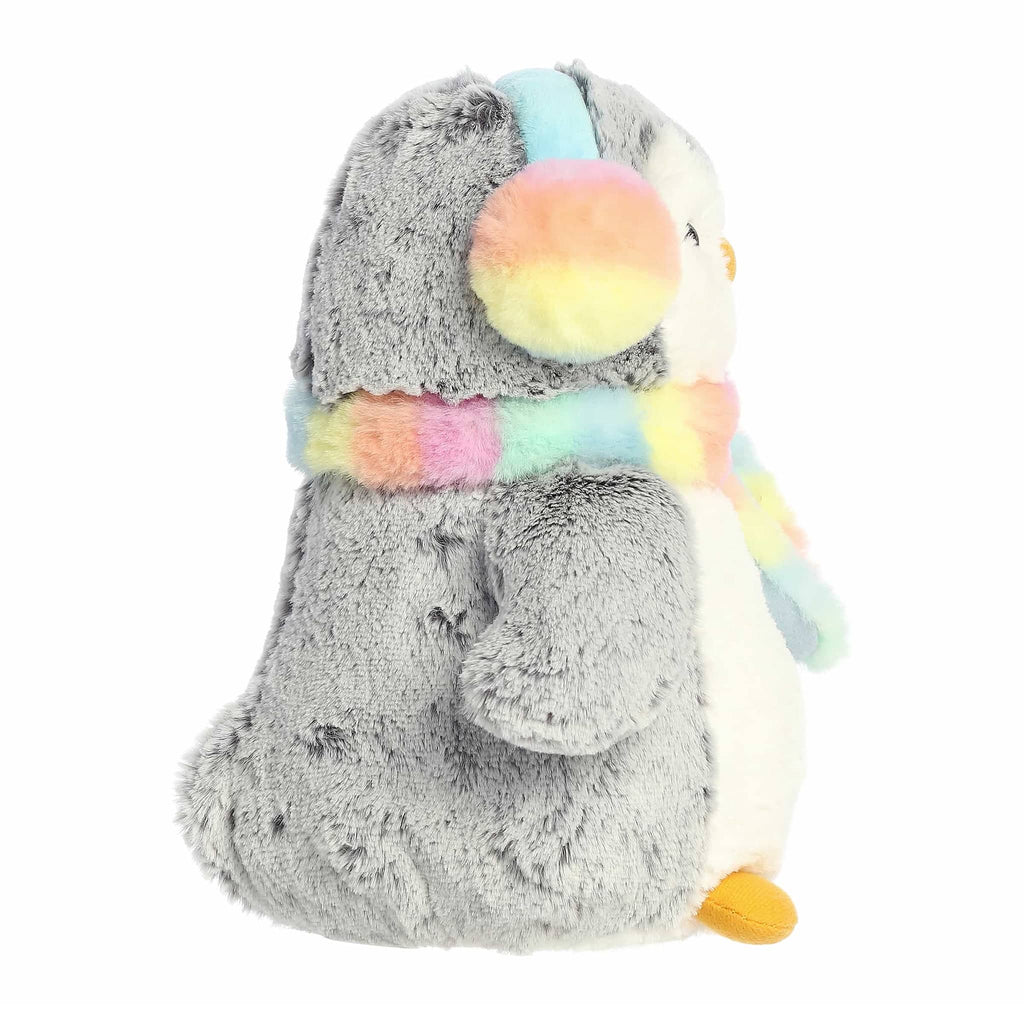 Plush penguin toy with a colorful scarf and earmuffs, side view, on a white background.