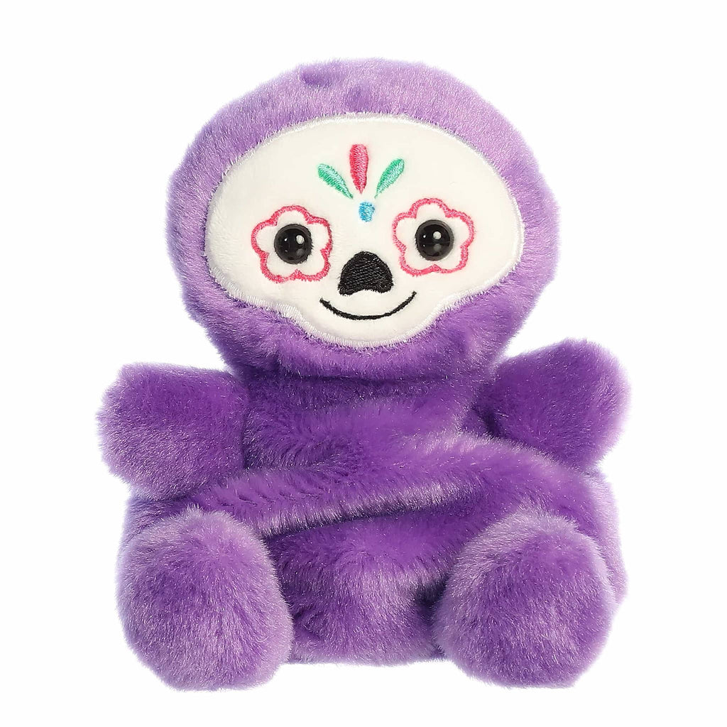 Purple plush toy with a smiling sugar skull style face, front view, on a white background.