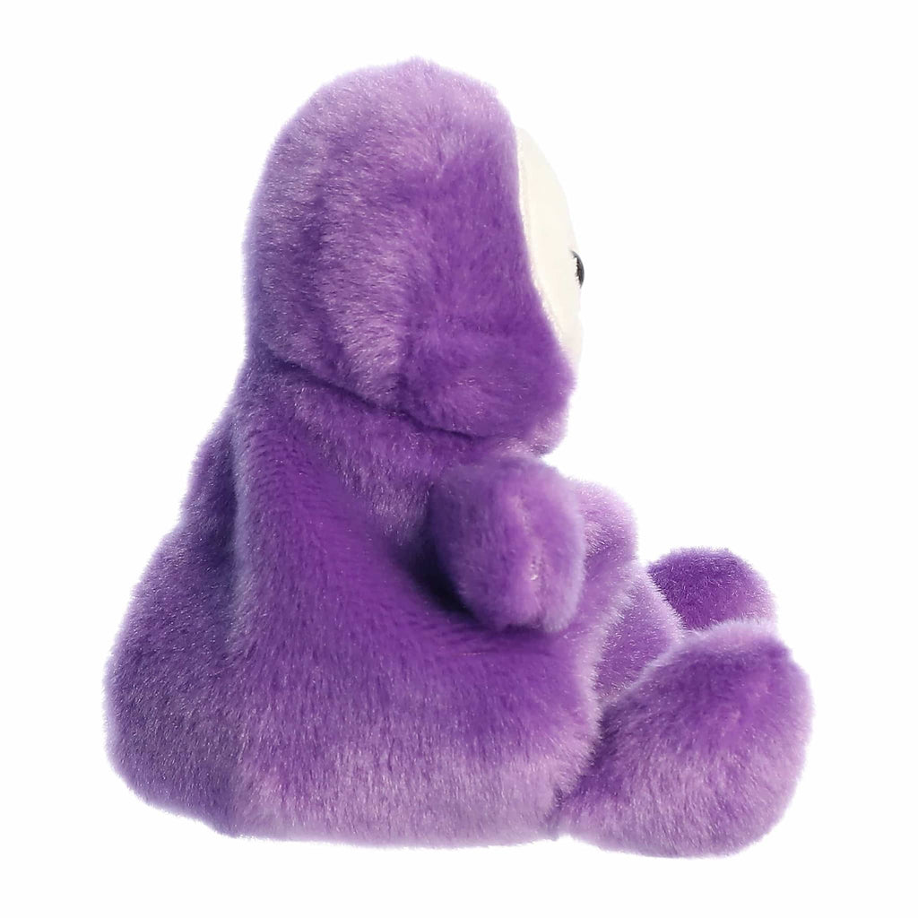 Purple plush toy with a smiling sugar skull style face, side view, on a white background.