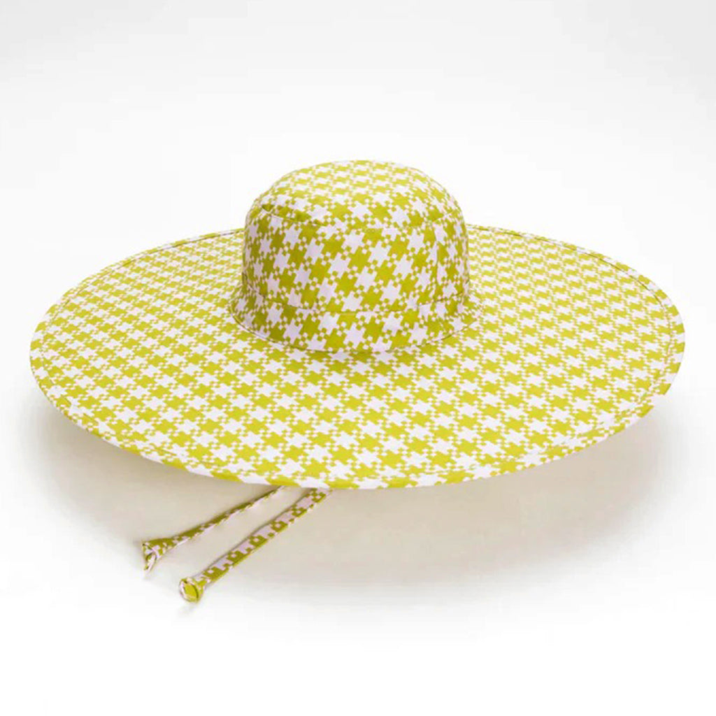 Baggu pink and pistachio green Pixel Gingham print cotton packable sun hat top view, open with chin straps peeking out from underneath.