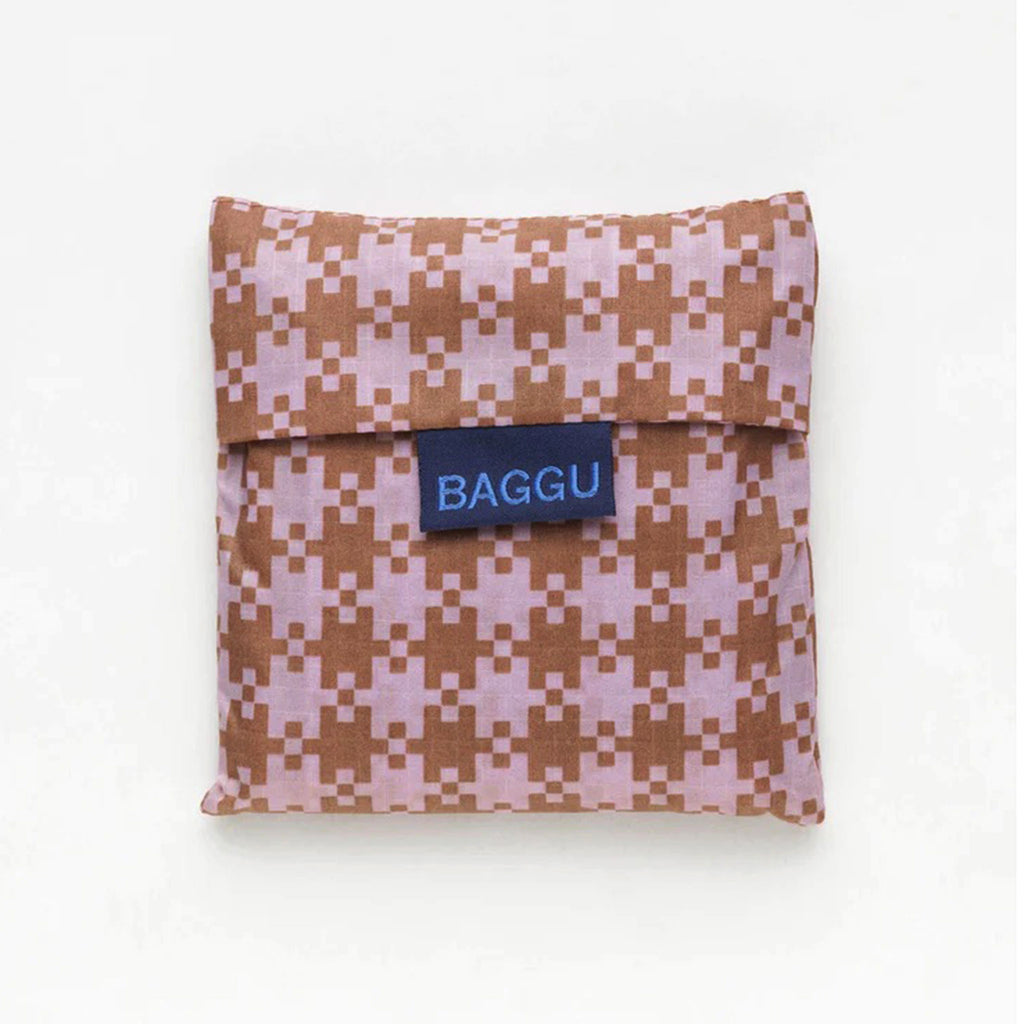 Baggu standard size eco-friendly-recycled ripstop nylon reusable tote bag with pink and brown pixel gingham pattern, in matching pouch.