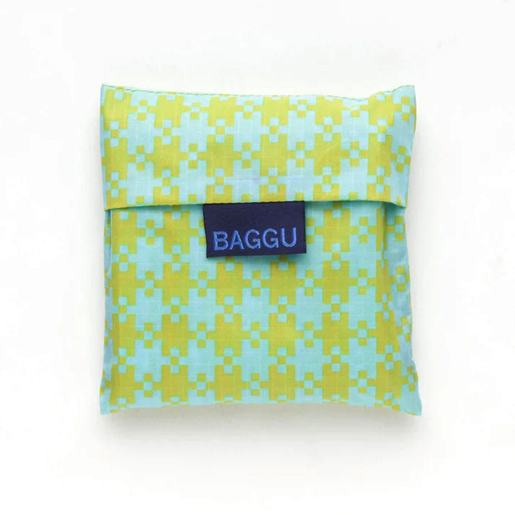 Baggu standard size eco-friendly-recycled ripstop nylon reusable tote bag with mint and pistachio green pixel gingham pattern, in matching pouch.