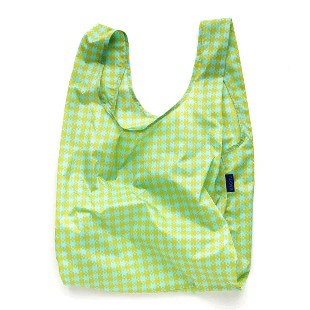 Baggu standard size eco-friendly-recycled ripstop nylon reusable tote bag with mint and pistachio green pixel gingham pattern, unfolded.