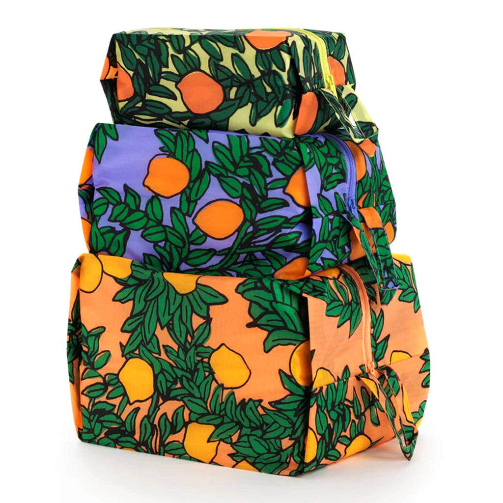 Baggu reusable recycled ripstop nylon 3D zip bags, set of 3 in Orange Trees print, stuffed and stacked.