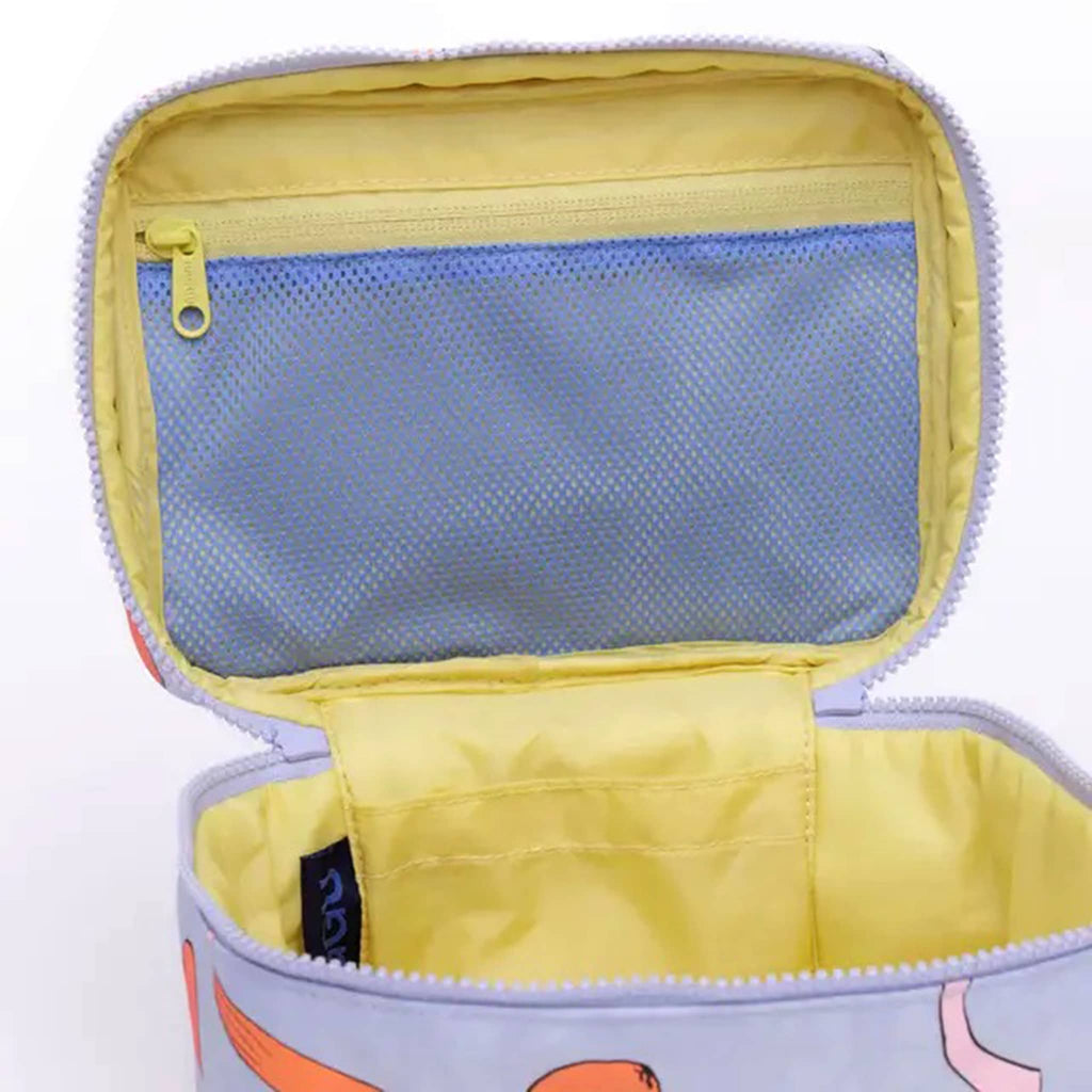 Baggu large cosmetic case with apricots and ribbons print, open with detail of interior pockets.