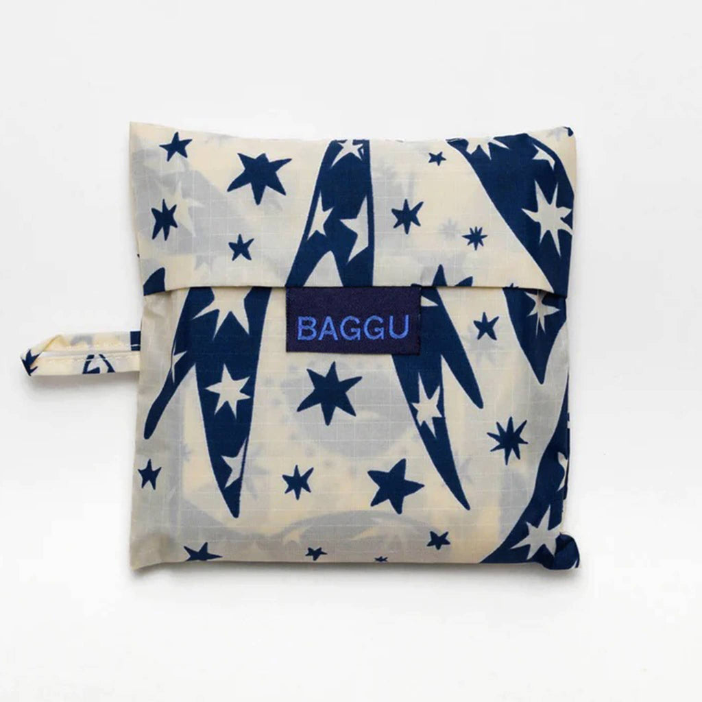 Baggu standard size eco-friendly recycled ripstop nylon reusable tote bag with blue and white Cherub Bows print, in matching pouch.