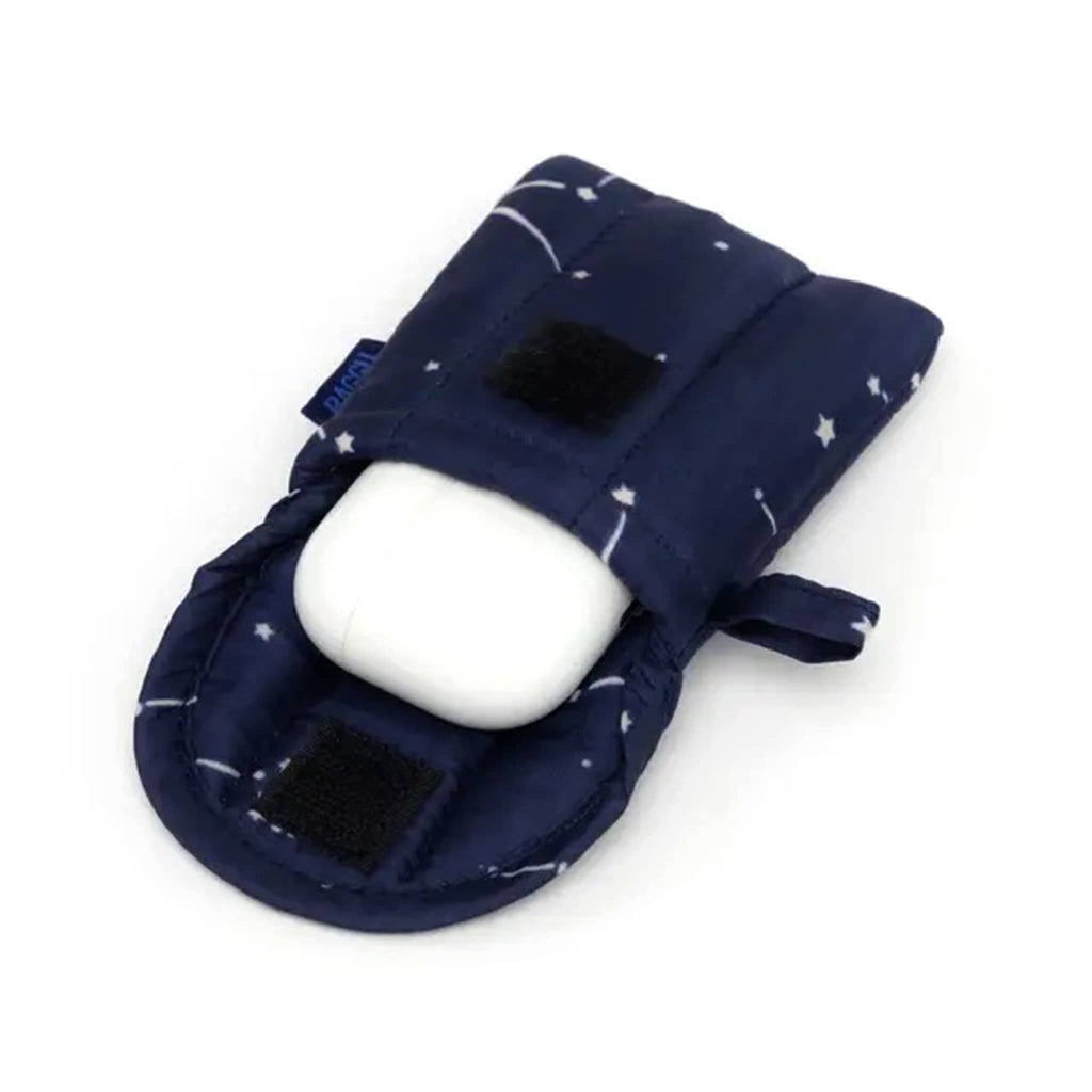 Baggu puffy earbuds case with constellation midnight print, open with airpods coming out.