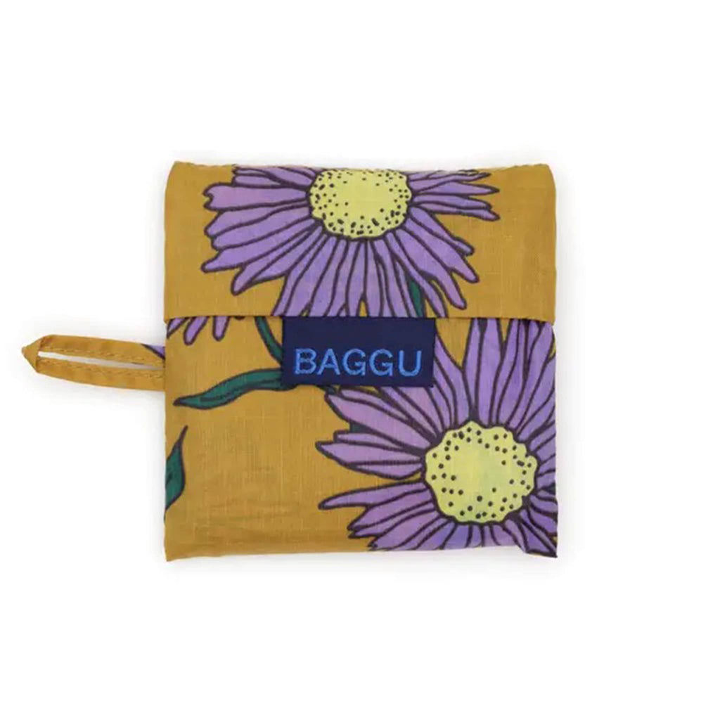 Floral-patterned reusable bag in matching pouch with 'BAGGU' branding on a white background.