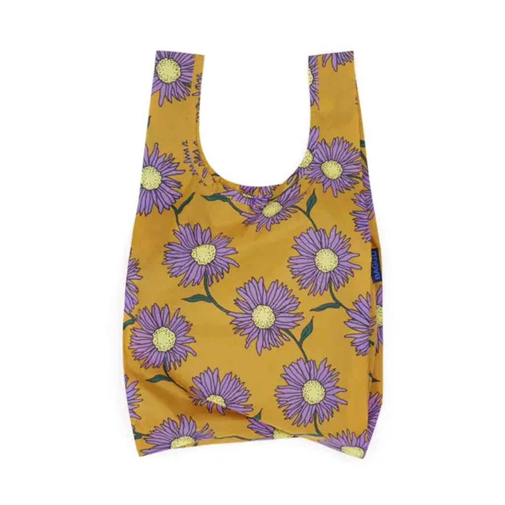 Reusable shopping bag with purple floral design on a yellow background.