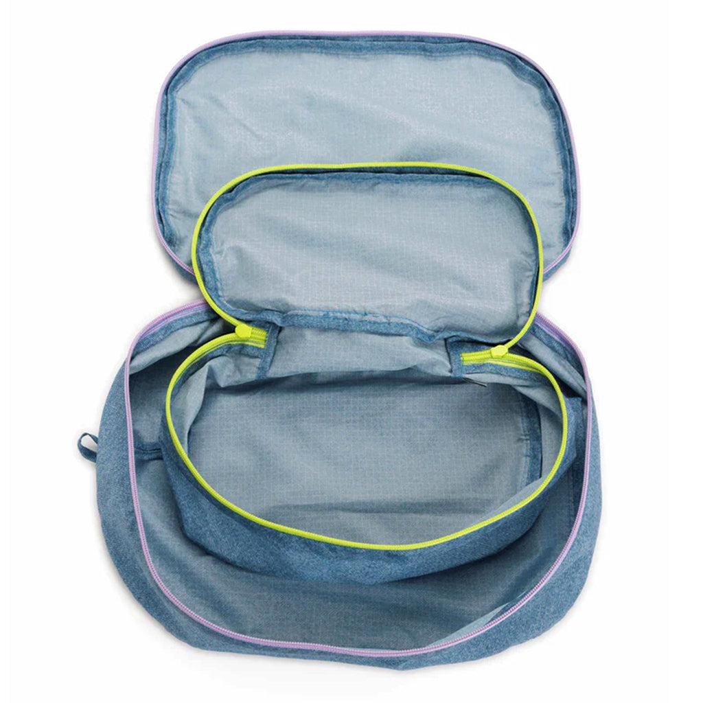 Baggu reusable recycled ripstop nylon packing cube set of 2 in digital denim print, large cube has a lilac zipper and the small cube has a chartreuse zipper, unzipped and nested.