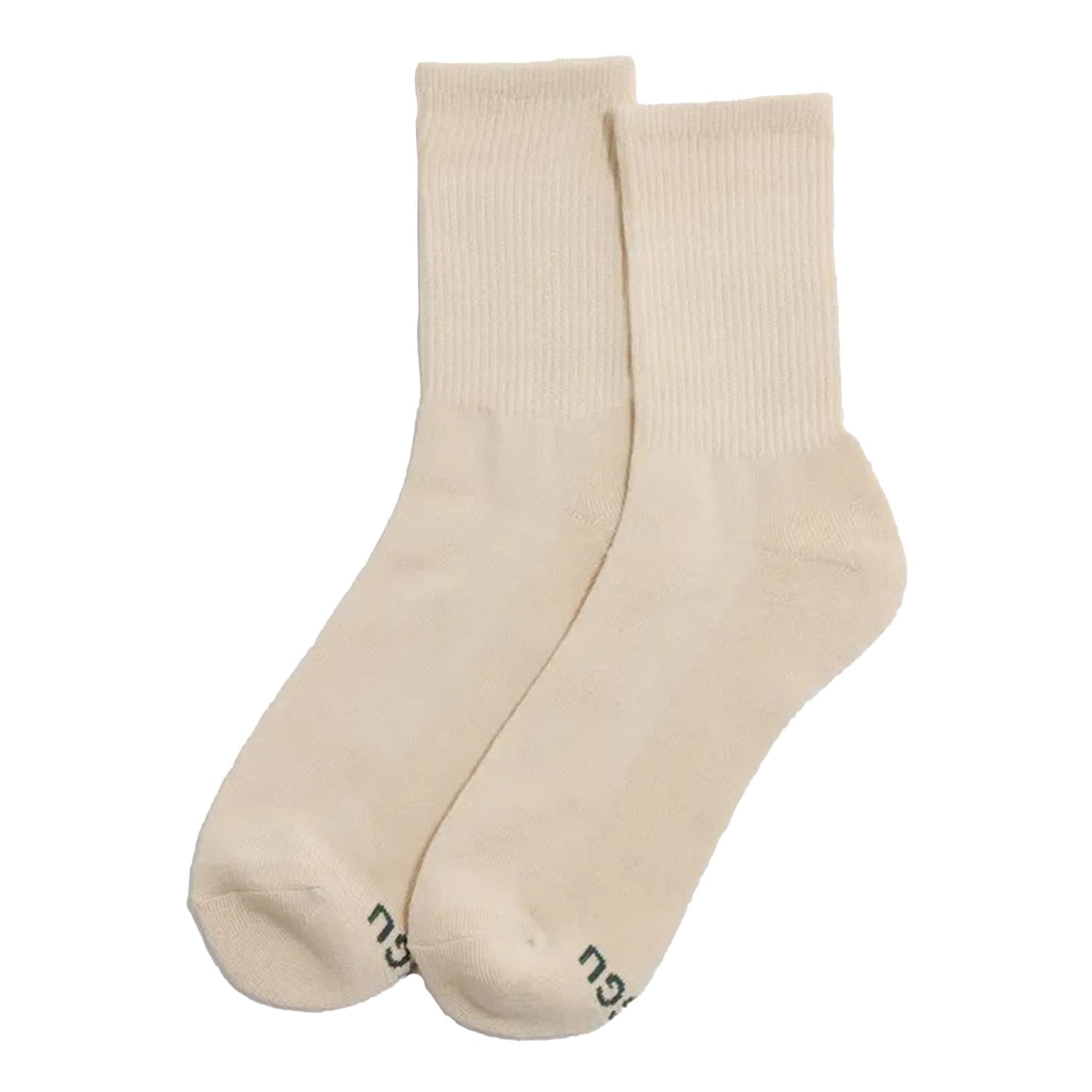 Pair of ribbed ecru socks on a white background.