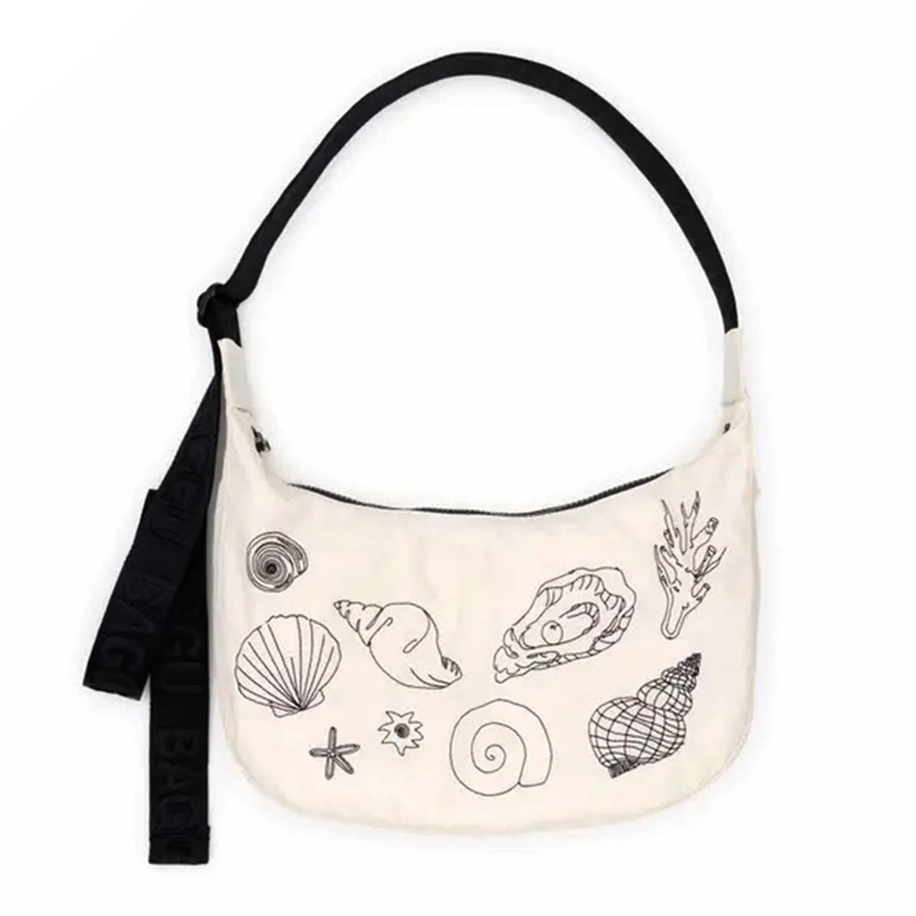 Baggu embroidere shells medium ripstop nylon crescent bag, front view.