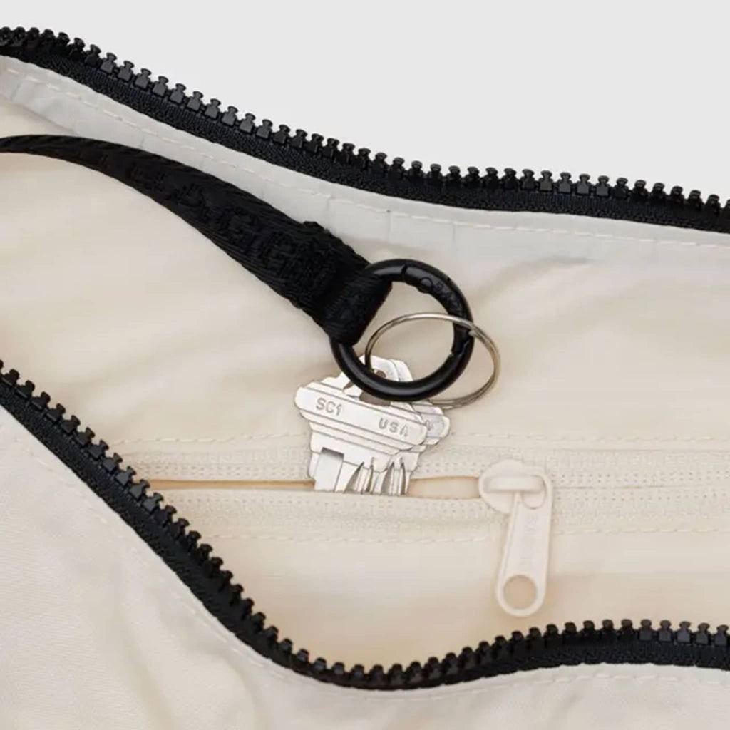 Baggu embroidere shells medium ripstop nylon crescent bag, interior detail.