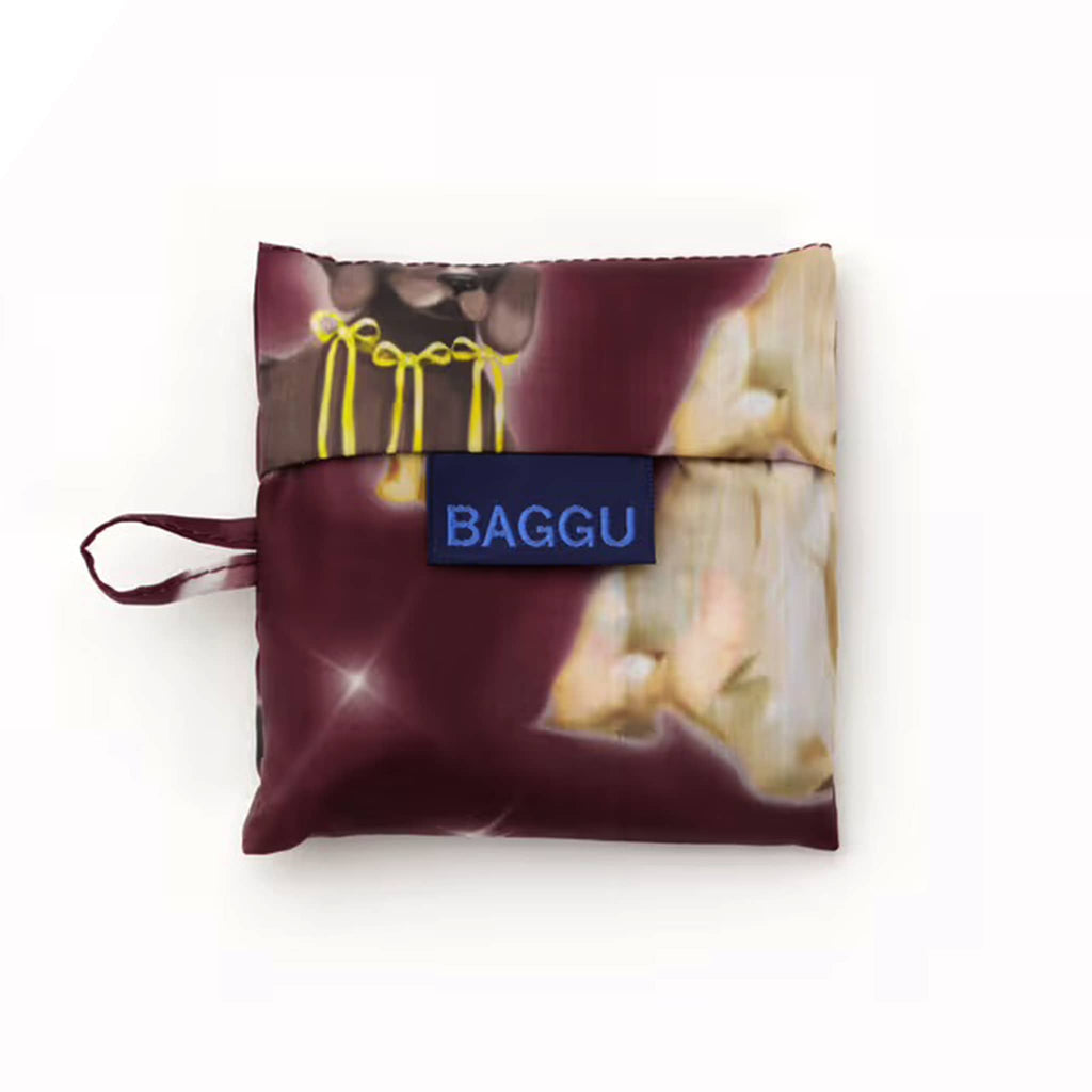 Baby Baggu reusable bag in Fancy Dogs, in matching pouch, on a white background.