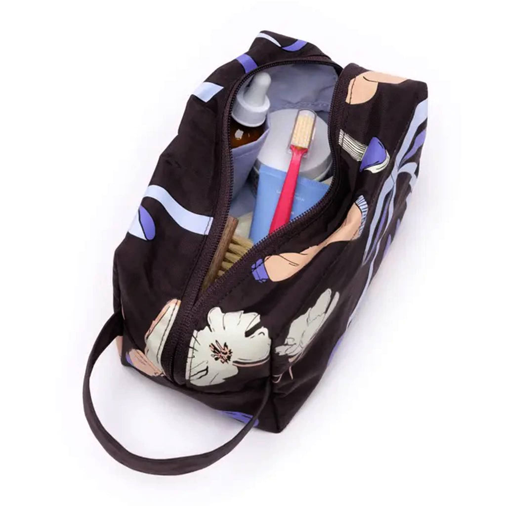 Baggu Dopp Kit in Get Ready With Me print, open with toiletries inside.