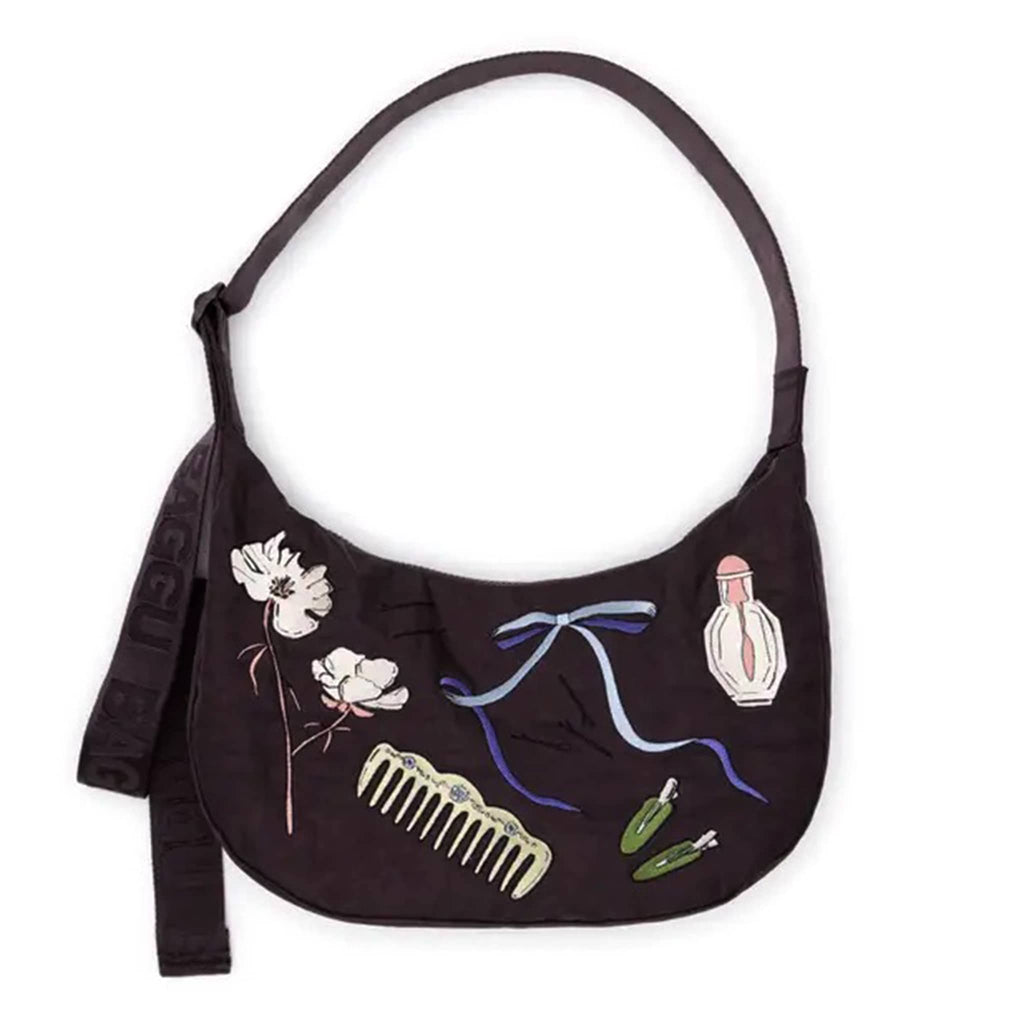 Baggu Medium Crescent Bag in Get Ready With Me embroidered on a black backdrop, front view.