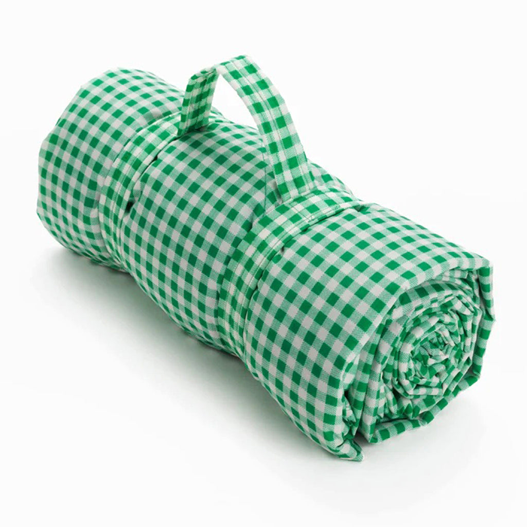 Baggu green gingham puffy recycled ripstop nylon and polyester picnic blanket, rolled up with strap.