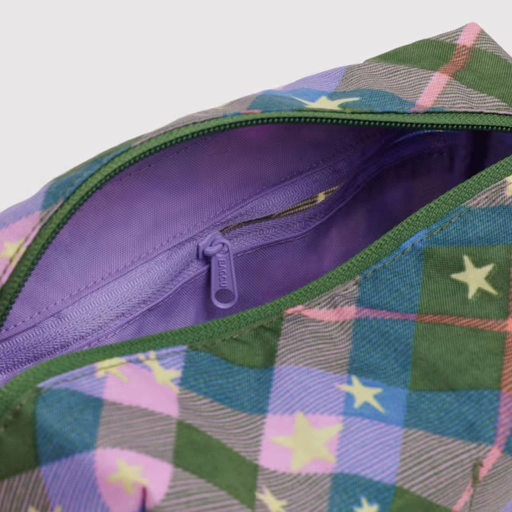 Detail of the Baggu Green Star Plaid Dopp Kit, interior zip pocket.