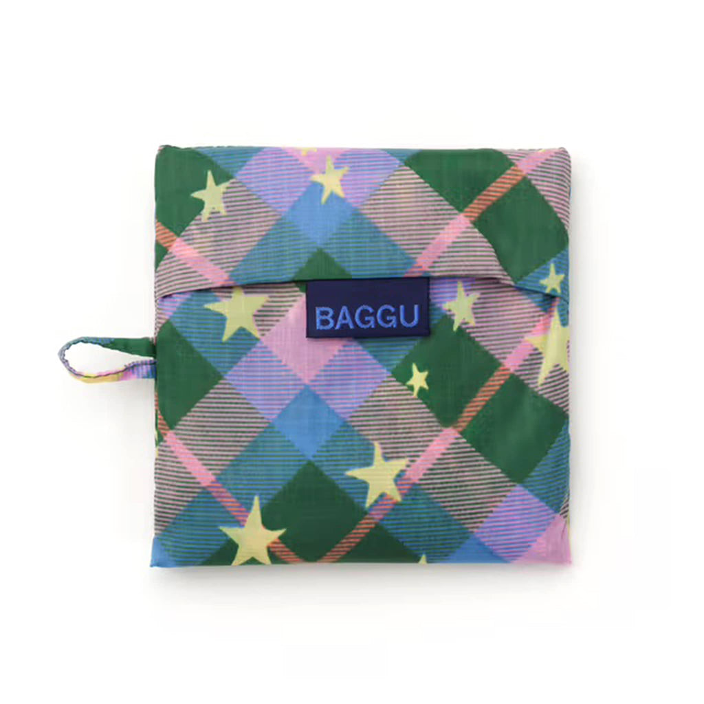 Multicolored plaid pouch with star patterns and 'BAGGU' logo on a white background.