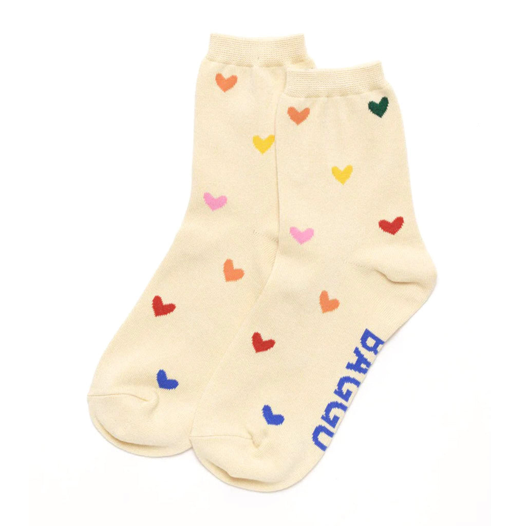 Baggu bamboo rayon unisex crew socks with with colorful hearts on an ecru backdrop, flat.