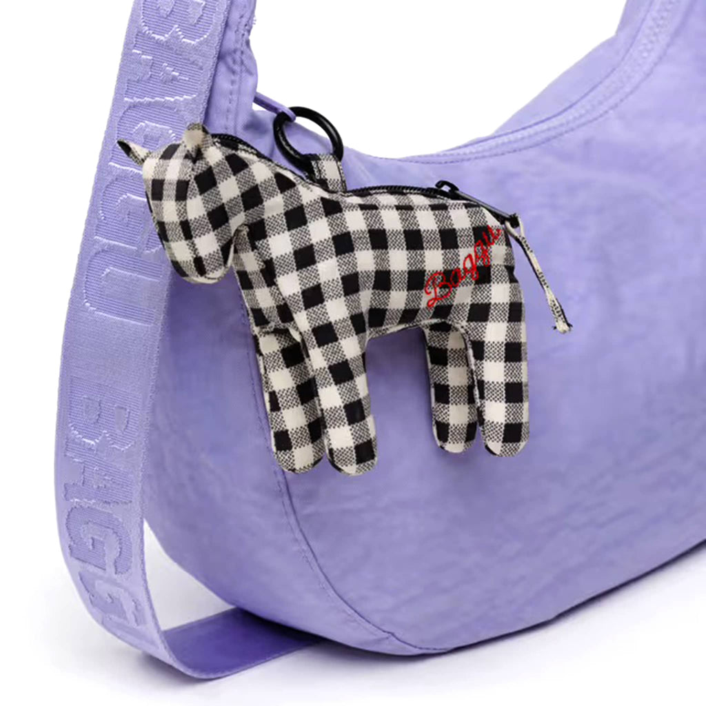 Black and white gingham horse-shaped keychain charm attached to a purple bag.
