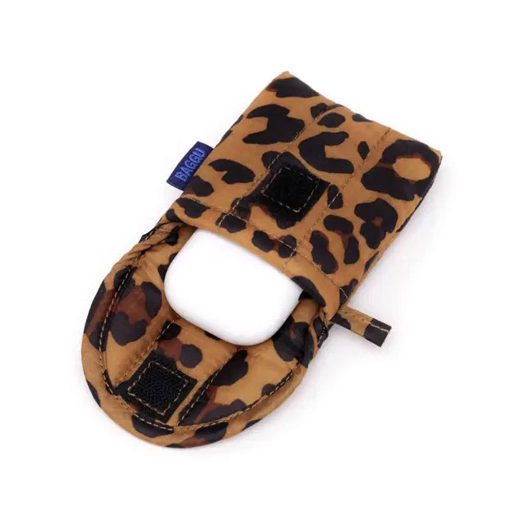 Baggu puffy earbuds case with leopard  print, open with airpods coming out.