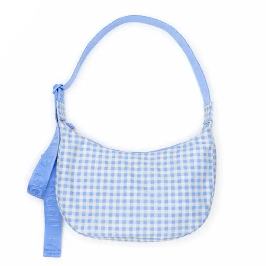 Baggu light blue gingham medium ripstop nylon crescent bag, front view.