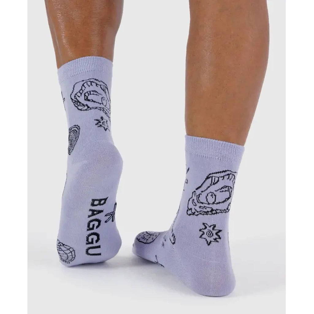Baggu Light Blue Shells bamboo rayon unisex crew socks, on models feet, back view.