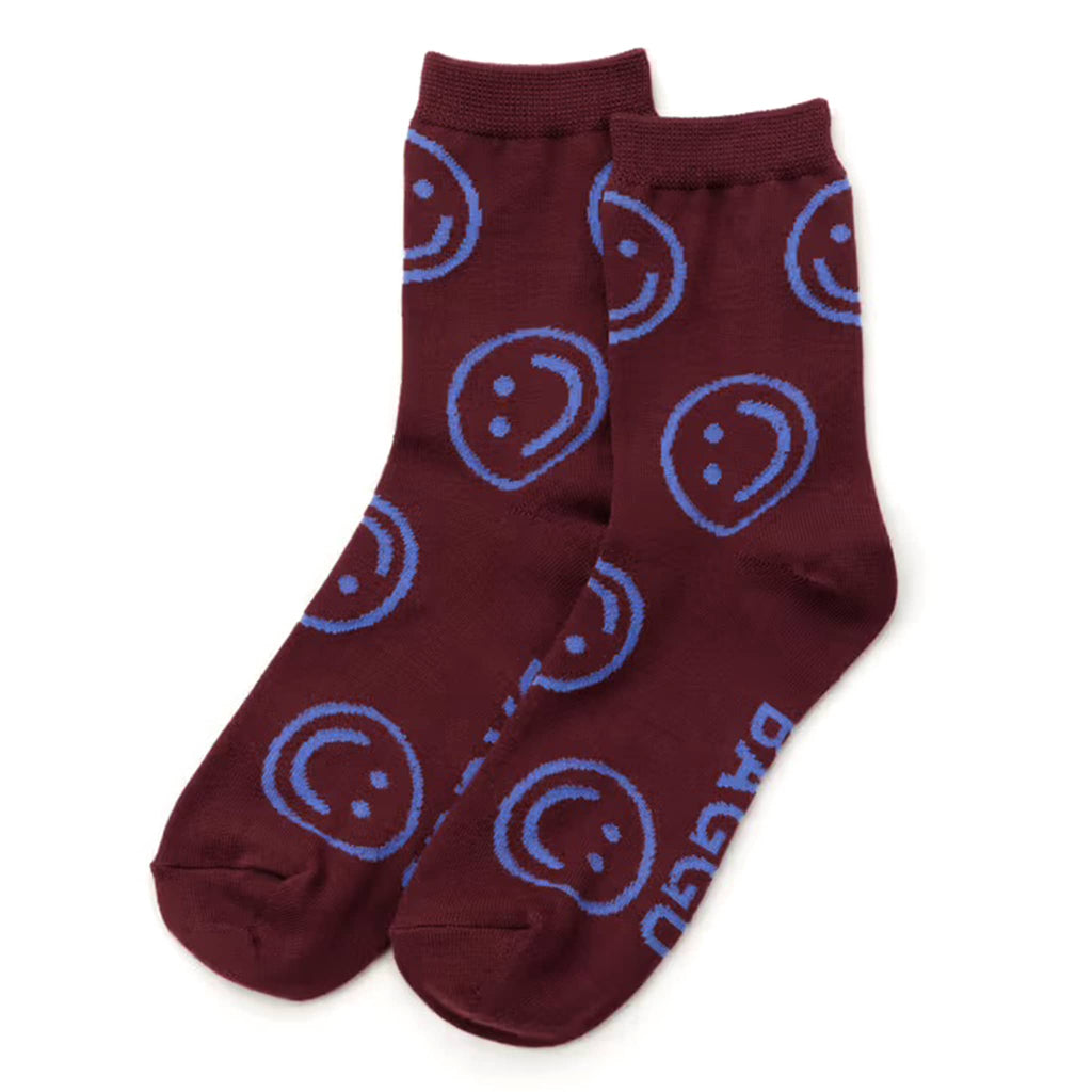 Mahogany socks with blue smiley face patterns on a white background.