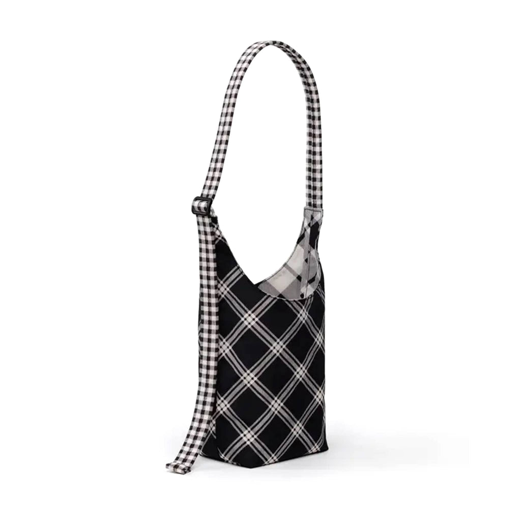 Black and white plaid bag with a strap on a white background.