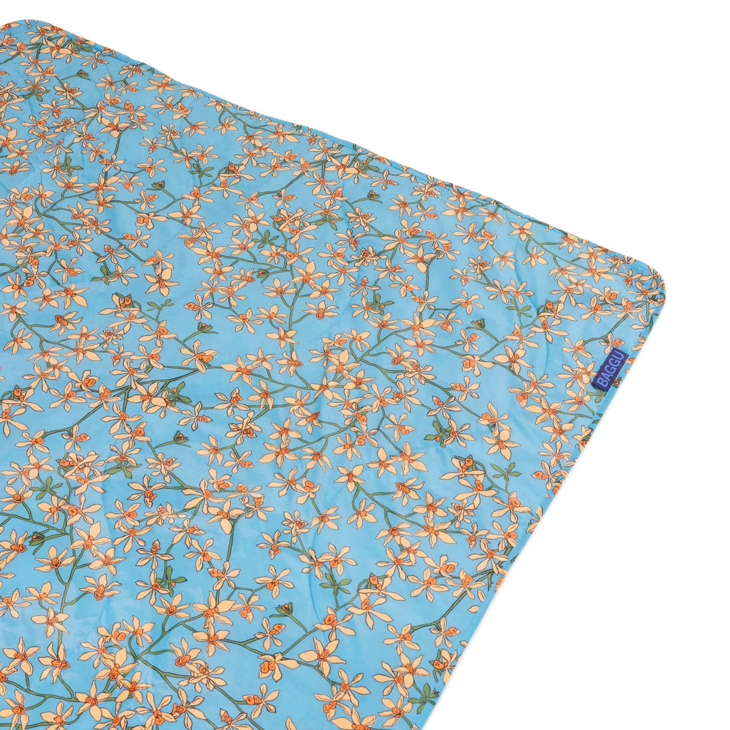 Baggu orchid puffy recycled ripstop nylon and polyester picnic blanket, flat with corner detail.