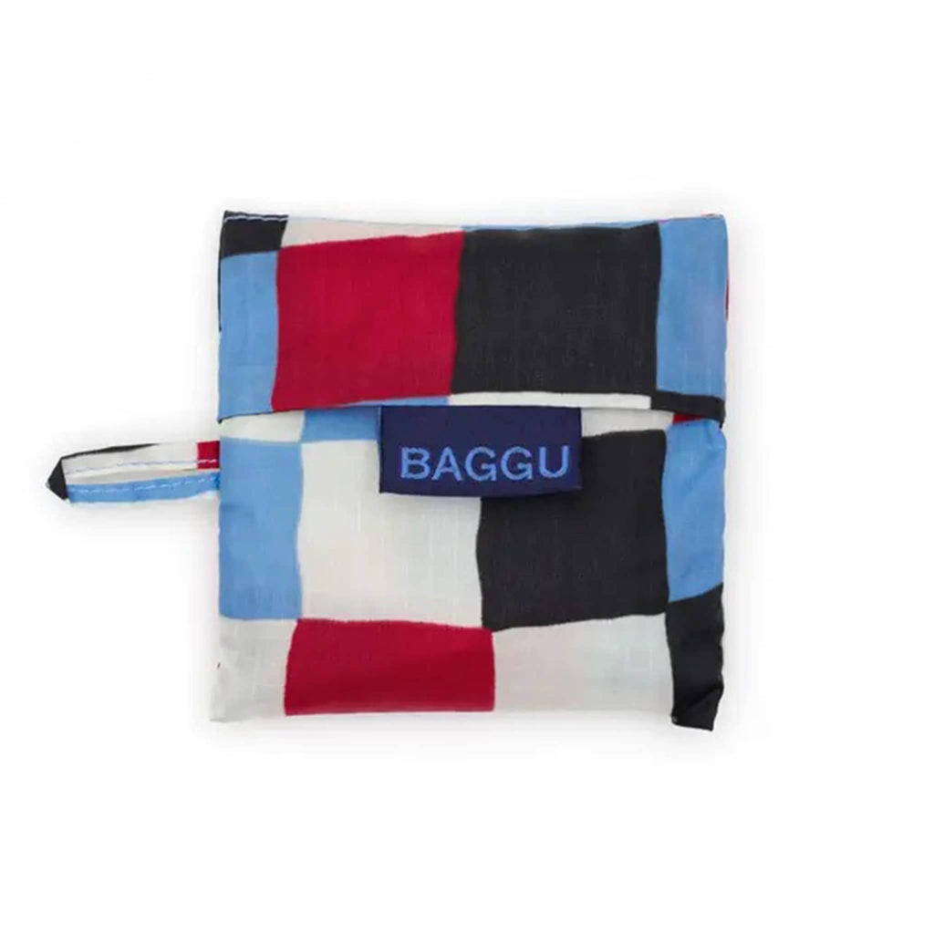 Colorful checkered pattern bag in matching pouch with 'BAGGU' logo on a white background.