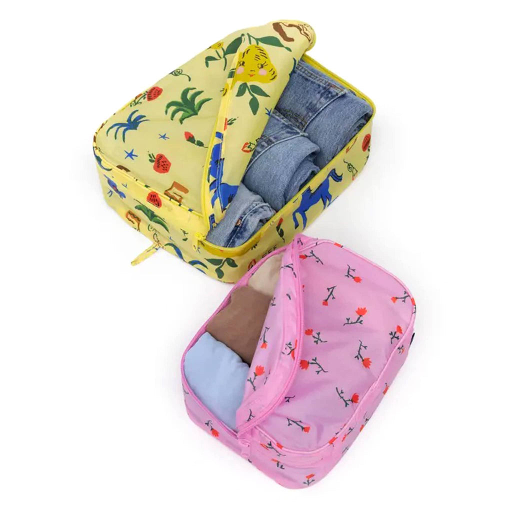 Baggu Painted Prairie reusable recycled nylon packing cubes, set of two, open and filled with clothes.