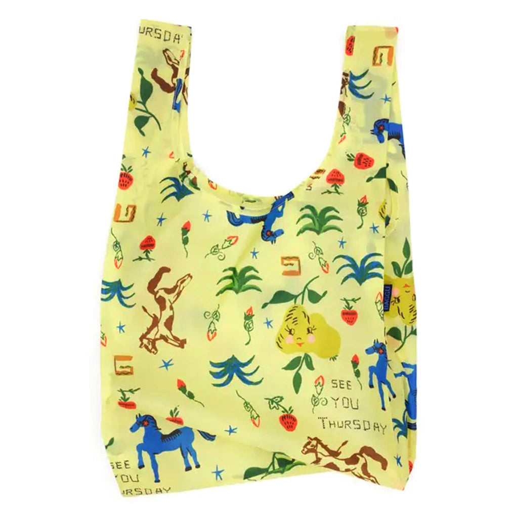 Reusable shopping bag with colorful animal and nature pattern on a white background.
