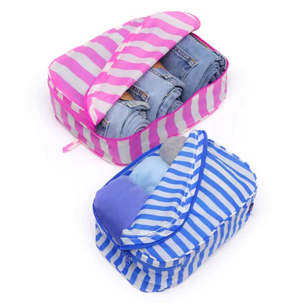 Baggu Painted Stripe reusable recycled nylon packing cubes, set of two stuffed with jeans and t-shirts, open.