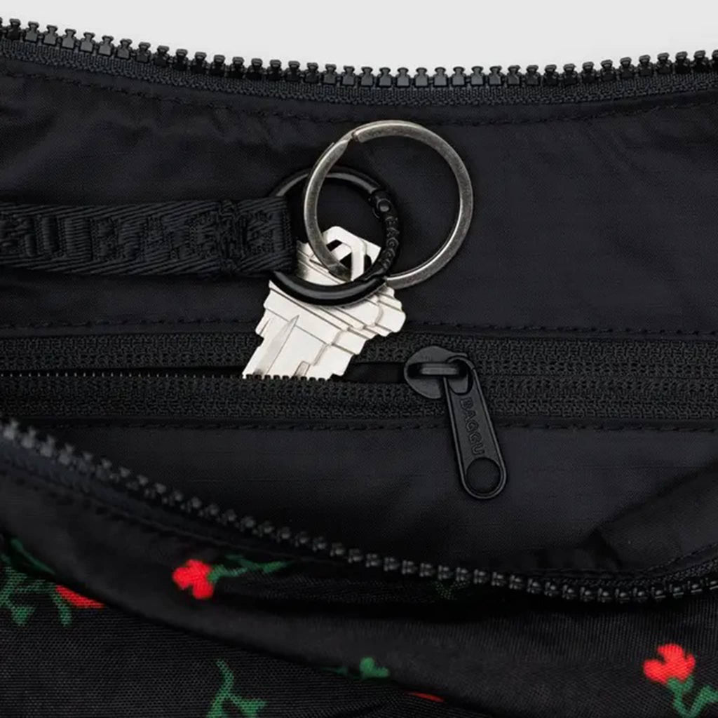 Baggu Painted Wildflower medium ripstop nylon crescent bag, detail of key ring and interior zip pocket.