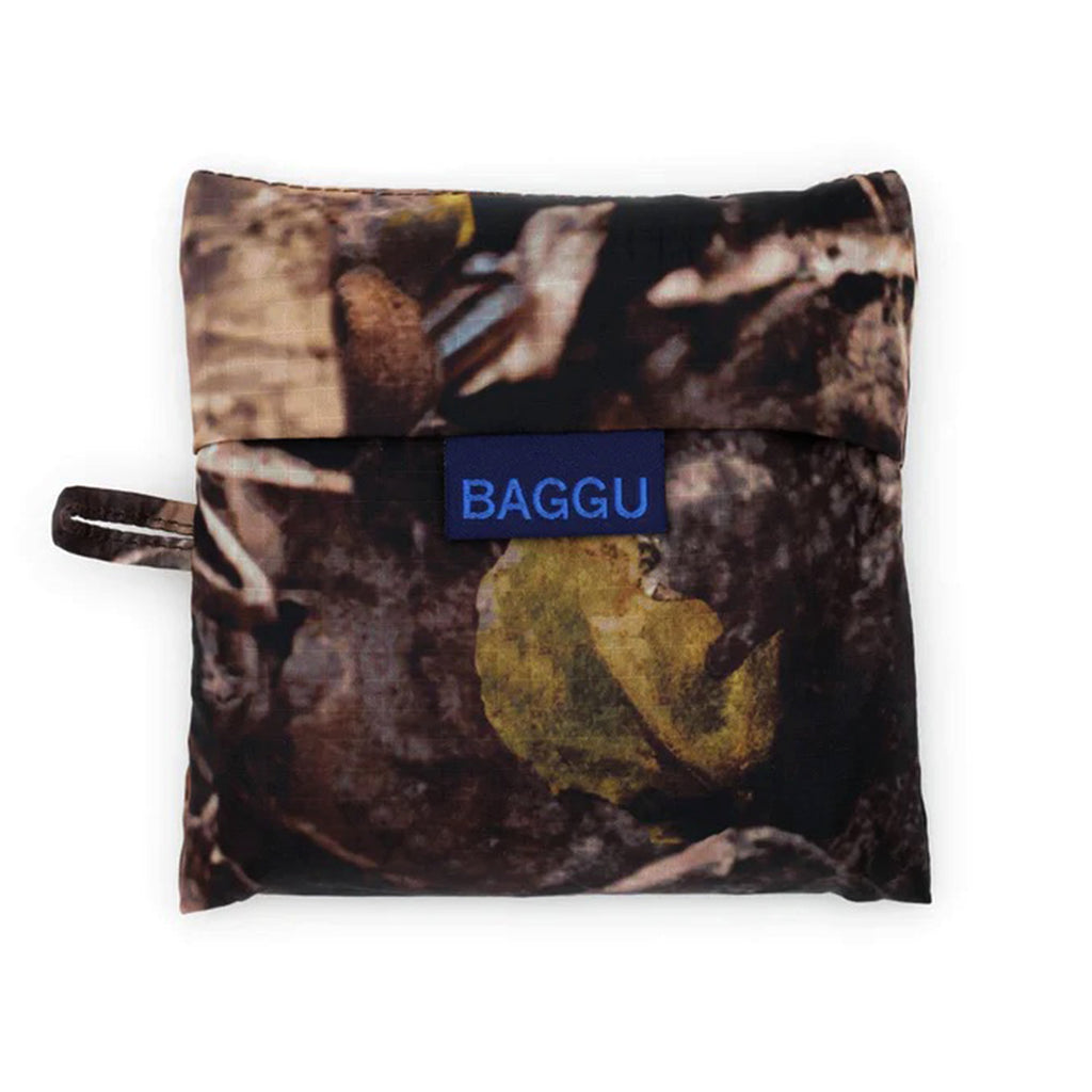 Baggu standard size eco-friendly recycled ripstop nylon reusable tote bag in Photo Forest, in pouch.