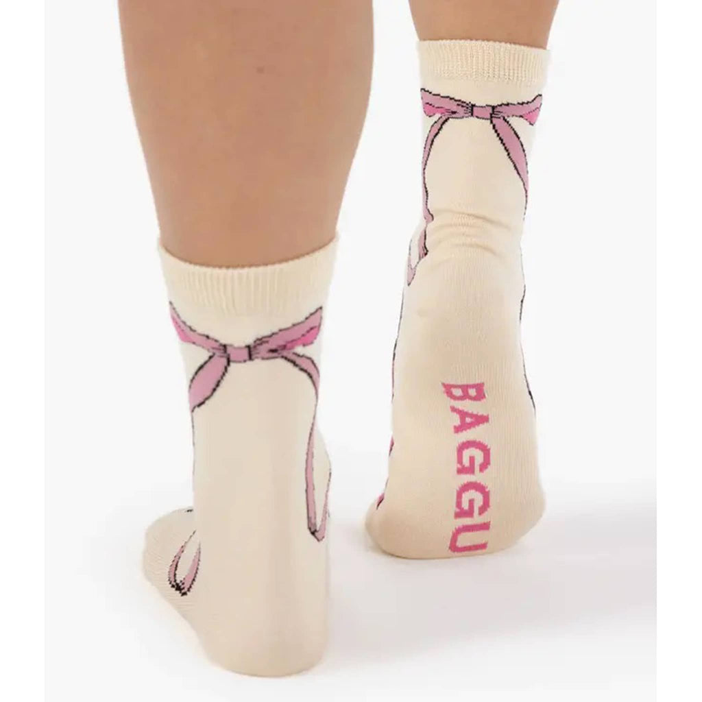 Baggu Bamboo Rayon Crew Socks in Pink Bow print, on model's feet.