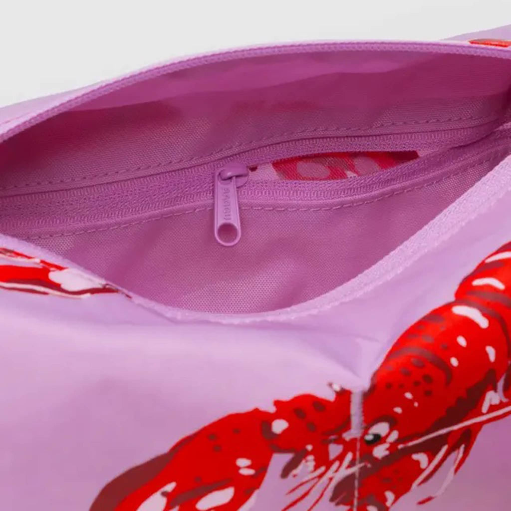 Baggu Pink Lobster Dopp Kit, interior zip pocket detail.