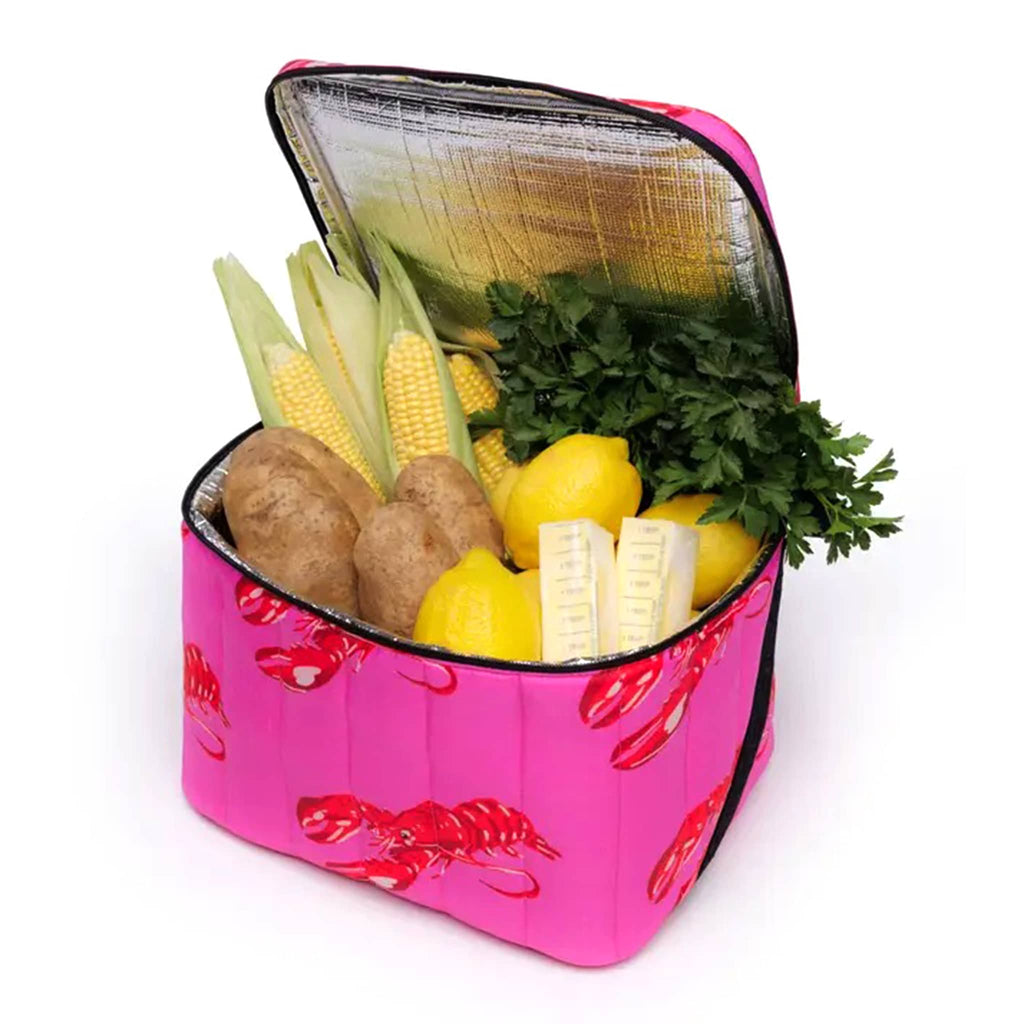 Baggu Pink Lobster insulated puffy cooler bag, front angle view, open, with food inside.
