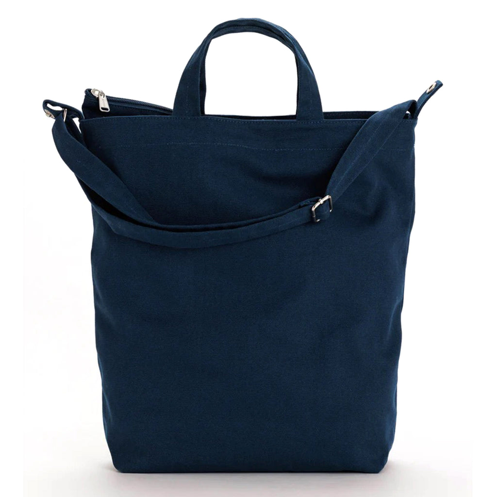 Baggu recycled cotton canvas duck bag tote with zip top closure in navy blue, front view.