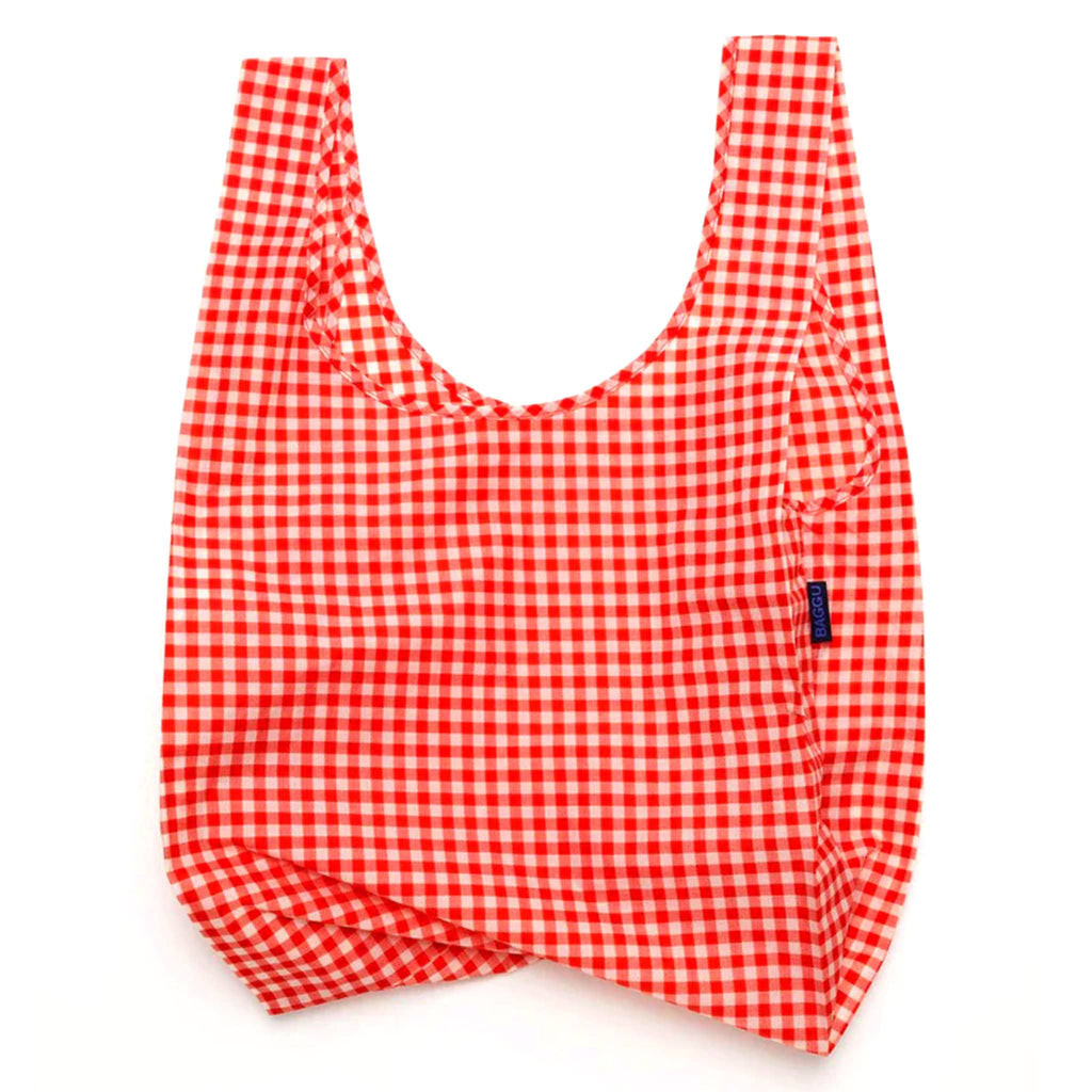 Baggu standard size eco-friendly recycled ripstop nylon reusable tote bag with red and white gingham print, unfolded.
