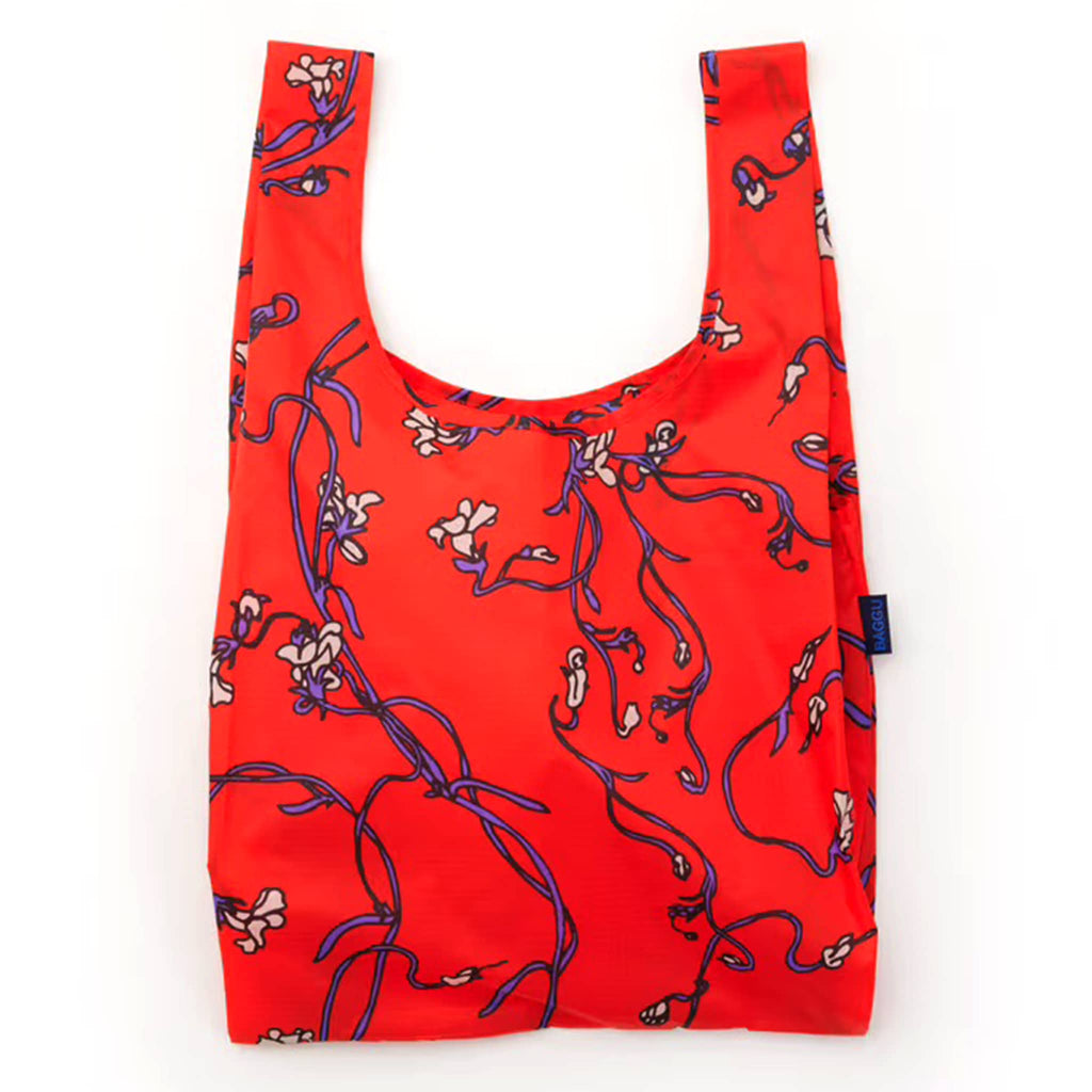 Red reusable bag with floral pattern on a white background.