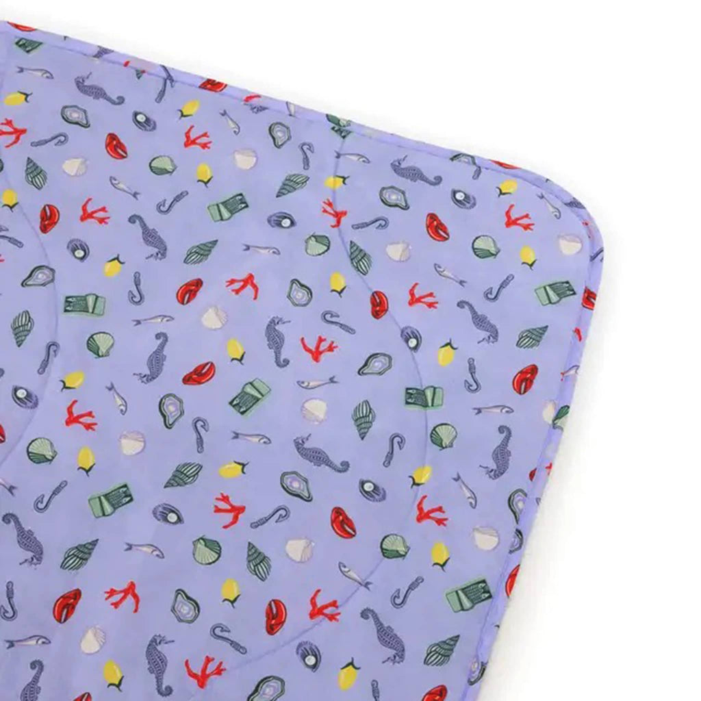Baggu Sea Charms puffy recycled ripstop nylon and polyester picnic blanket, corner detail.