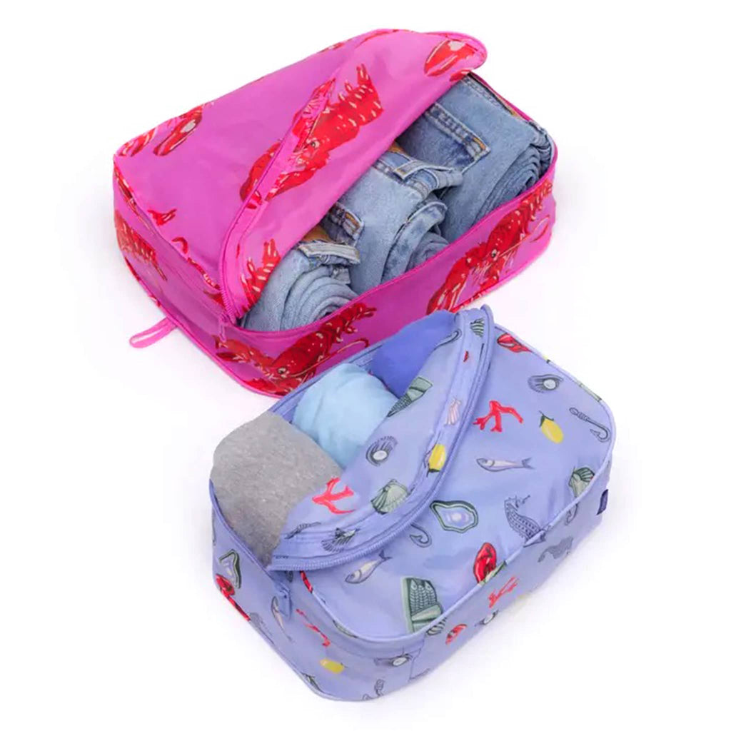 Baggu Sea Creatures reusable recycled nylon packing cubes, set of two stuffed with jeans and t-shirts, open.
