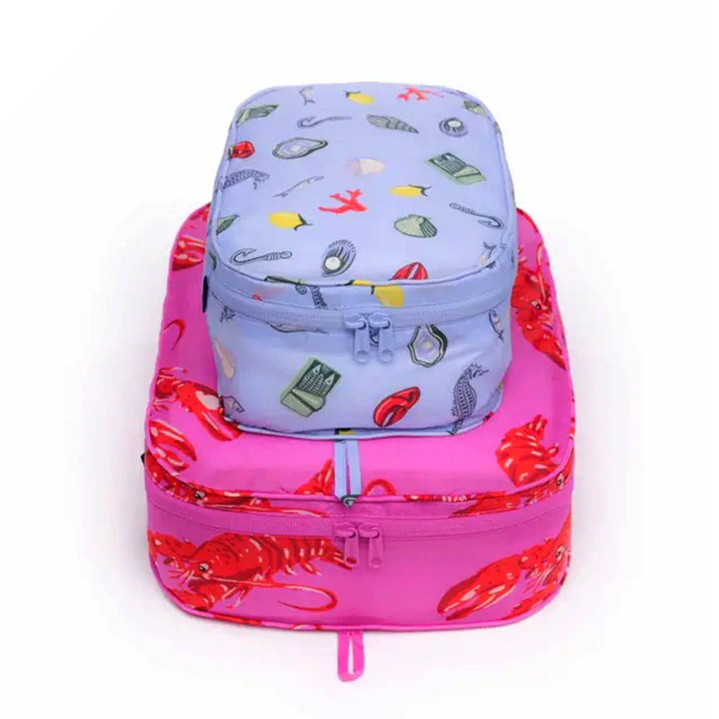 Baggu Sea Creatures reusable recycled nylon packing cubes, set of two stuffed and stacked.