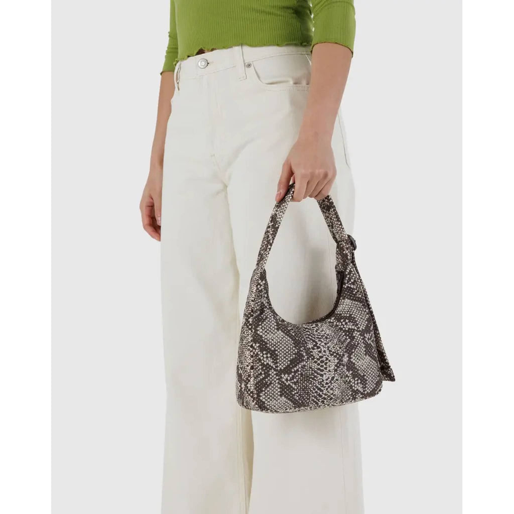 Baggu Mini Nylon Shoulder Bag in Snakeskin print, in model's hand.