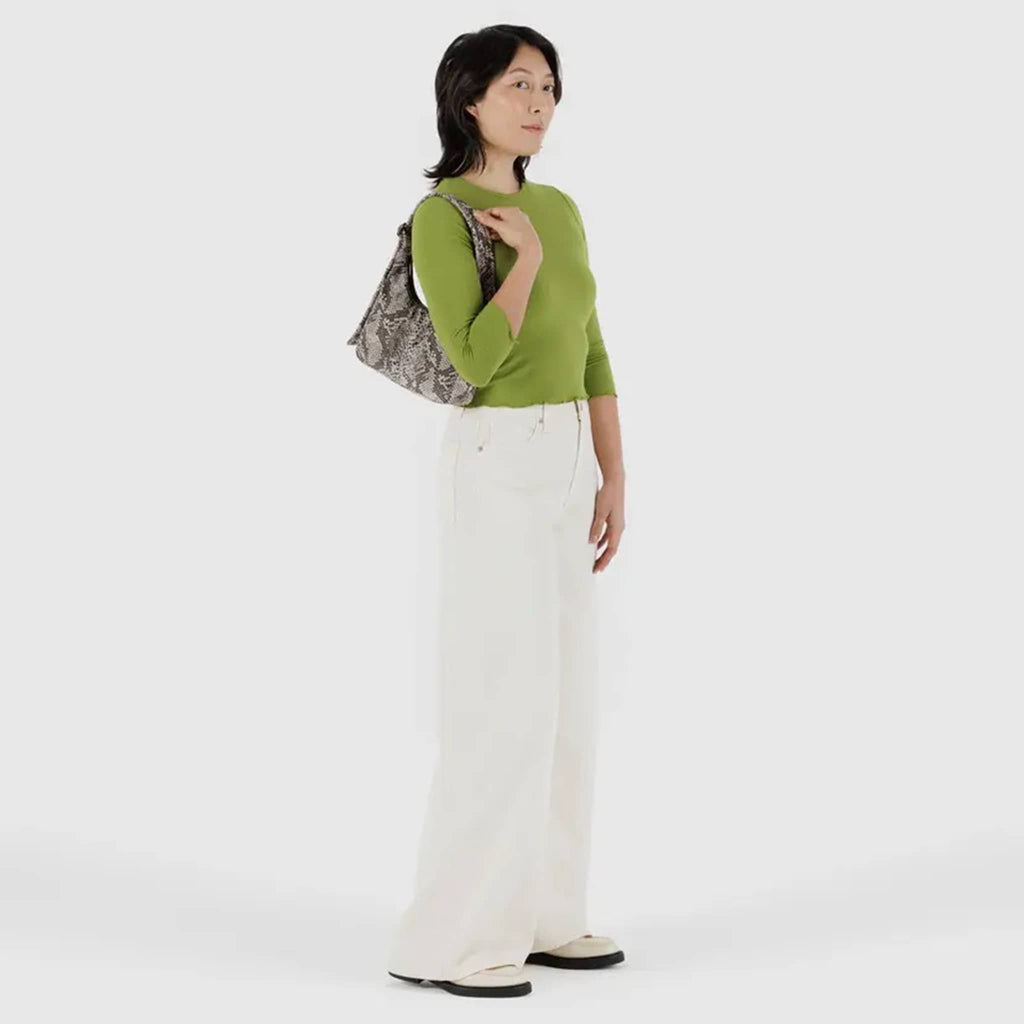 Baggu Mini Nylon Shoulder Bag in Snakeskin print, on model's shoulder.